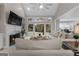 Inviting living room with a fireplace, large windows, and comfortable seating at 216 Southwick Ln, Peachtree City, GA 30269