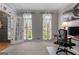 Bright office space featuring neutral walls, carpeted floors, and French doors at 216 Southwick Ln, Peachtree City, GA 30269