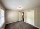 Cozy bedroom with neutral paint, carpeted floors, and a convenient closet at 1994 Marvin Sw Ln, Atlanta, GA 30311