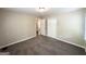 Neutral bedroom with large closet and gray carpet, offering a serene and comfortable space at 1994 Marvin Sw Ln, Atlanta, GA 30311