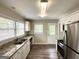 Updated kitchen featuring granite countertops, stainless steel appliances and ample natural light at 1994 Marvin Sw Ln, Atlanta, GA 30311