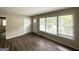 Bright living room with vinyl flooring featuring access to the front yard at 1994 Marvin Sw Ln, Atlanta, GA 30311
