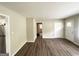 Bright living room with modern vinyl floors leading to kitchen and bedrooms at 1994 Marvin Sw Ln, Atlanta, GA 30311