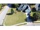Expansive lawn with meticulously maintained landscaping and a lengthy driveway on corner lot at 200 Kensington Trce, Stockbridge, GA 30281