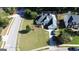 Expansive lawn with meticulously maintained landscaping and a lengthy driveway on corner lot at 200 Kensington Trce, Stockbridge, GA 30281