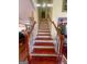 Staircase with white risers and wood treads at 200 Kensington Trce, Stockbridge, GA 30281