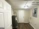 Basement utility room features vinyl floors and a recently serviced hot water heater at 2099 Yucca Dr, Decatur, GA 30032