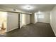 Finished basement boasts neutral walls, soft carpet, and a bathroom with granite vanity at 2099 Yucca Dr, Decatur, GA 30032