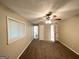 Neutral bedroom features plush carpeting, ceiling fan, and plenty of natural light through the window at 2099 Yucca Dr, Decatur, GA 30032