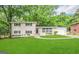 Charming two-story home with a well-manicured lawn and lush landscaping, complemented by a neutral-toned exterior at 2099 Yucca Dr, Decatur, GA 30032