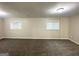Spacious Living Room with neutral walls, soft carpet, and plentiful natural light at 2099 Yucca Dr, Decatur, GA 30032