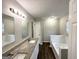 Bathroom with double vanity, granite countertops and a bathtub at 2578 Lavender Ct, Decatur, GA 30034