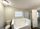 Bathroom featuring a tub, a separate shower, and a toilet at 2578 Lavender Ct, Decatur, GA 30034