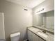 Bathroom with granite countertops, contemporary lighting, and modern fixtures, providing a stylish and functional space at 2578 Lavender Ct, Decatur, GA 30034