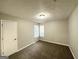 A cozy bedroom featuring neutral paint, carpeted flooring, and bright windows for comfortable living at 2578 Lavender Ct, Decatur, GA 30034