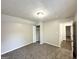A cozy bedroom featuring neutral paint, carpeted flooring, and a closet space perfect for comfortable living at 2578 Lavender Ct, Decatur, GA 30034