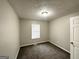Simple bedroom with neutral carpet and a single window at 2578 Lavender Ct, Decatur, GA 30034
