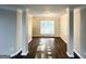 Open-concept living room with neutral paint, crown molding and gleaming floors at 2578 Lavender Ct, Decatur, GA 30034