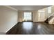 Inviting living room featuring new wood floors, neutral walls, and a staircase at 2578 Lavender Ct, Decatur, GA 30034