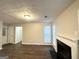 Inviting living room featuring new wood floors, a fireplace, and neutral walls at 2578 Lavender Ct, Decatur, GA 30034