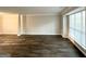 Spacious living room featuring gorgeous floors and large windows for plenty of natural light at 2578 Lavender Ct, Decatur, GA 30034