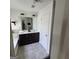 Bathroom with double sink vanity, white door, and updated fixtures in a home at 3168 Spicy Cedar Ln, Lithonia, GA 30038