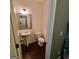 Clean and simple half bathroom featuring a pedestal sink and modern fixtures at 3168 Spicy Cedar Ln, Lithonia, GA 30038