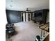 Large bonus room with carpet and media area at 3168 Spicy Cedar Ln, Lithonia, GA 30038