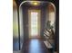 Welcoming entryway with dark hardwood floors, archway and decorative wood paneling at 3168 Spicy Cedar Ln, Lithonia, GA 30038