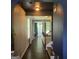Hallway with dark hardwood floors leading to a view of the living room at 3168 Spicy Cedar Ln, Lithonia, GA 30038