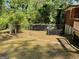 Large backyard partially enclosed by a chain-link fence at 1815 Dodson Sw Dr, Atlanta, GA 30311