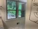 Window in bathroom allowing ample natural light to flow into the space at 1815 Dodson Sw Dr, Atlanta, GA 30311