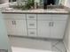 Bathroom features granite countertops, dual sinks, and white cabinets at 1815 Dodson Sw Dr, Atlanta, GA 30311