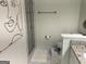 Modern bathroom showcasing a glass-enclosed shower and simple step-stool at 1815 Dodson Sw Dr, Atlanta, GA 30311