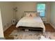 Cozy bedroom features natural light and a neutral palette for a relaxing atmosphere at 1815 Dodson Sw Dr, Atlanta, GA 30311
