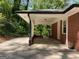 View of the house carport featuring a concrete floor and white ceiling at 1815 Dodson Sw Dr, Atlanta, GA 30311