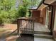A cozy wooden deck adds outdoor living space to this brick home, perfect for relaxation at 1815 Dodson Sw Dr, Atlanta, GA 30311