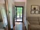Bright entryway with hardwood floors, a stylish mirror, and views of the outdoors through the front door at 1815 Dodson Sw Dr, Atlanta, GA 30311