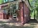 Two-story brick home exterior with well-maintained lawn and landscaping at 1815 Dodson Sw Dr, Atlanta, GA 30311