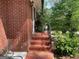 Inviting front entrance with brick steps and charming details at 1815 Dodson Sw Dr, Atlanta, GA 30311