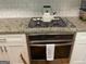 Modern kitchen features an oven, stainless steel appliances and sleek countertops at 1815 Dodson Sw Dr, Atlanta, GA 30311