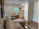 Inviting living room with a comfortable sectional sofa and an open view to the dining area at 1815 Dodson Sw Dr, Atlanta, GA 30311