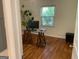 Bright home office features hardwood floors, a large window, and a view of the backyard at 1815 Dodson Sw Dr, Atlanta, GA 30311