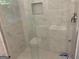 Modern shower features glass enclosure, marble tiling, and a rain shower head at 1815 Dodson Sw Dr, Atlanta, GA 30311
