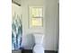 Bathroom featuring a toilet next to the shower with nature scenery on the curtain at 11755 Highway 36, Covington, GA 30014
