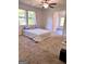 Bright bedroom featuring natural light from large windows and a light-colored carpet at 11755 Highway 36, Covington, GA 30014