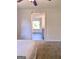 Open bedroom doorway leads to an additional room with a sunny window at 11755 Highway 36, Covington, GA 30014