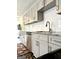 Updated kitchen features granite countertops, stainless steel appliances, and modern cabinetry at 11755 Highway 36, Covington, GA 30014