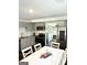 Open floor plan showcasing the kitchen with modern appliances and a dining area at 11755 Highway 36, Covington, GA 30014