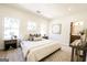 Bright bedroom features neutral decor, a large window, and a bed with decorative pillows at 185 Wadley Nw St, Atlanta, GA 30314